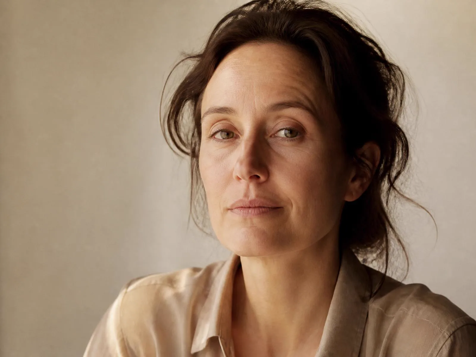 Portrait of a woman in natural light, unretouched skin, facial aesthetic medicine practice